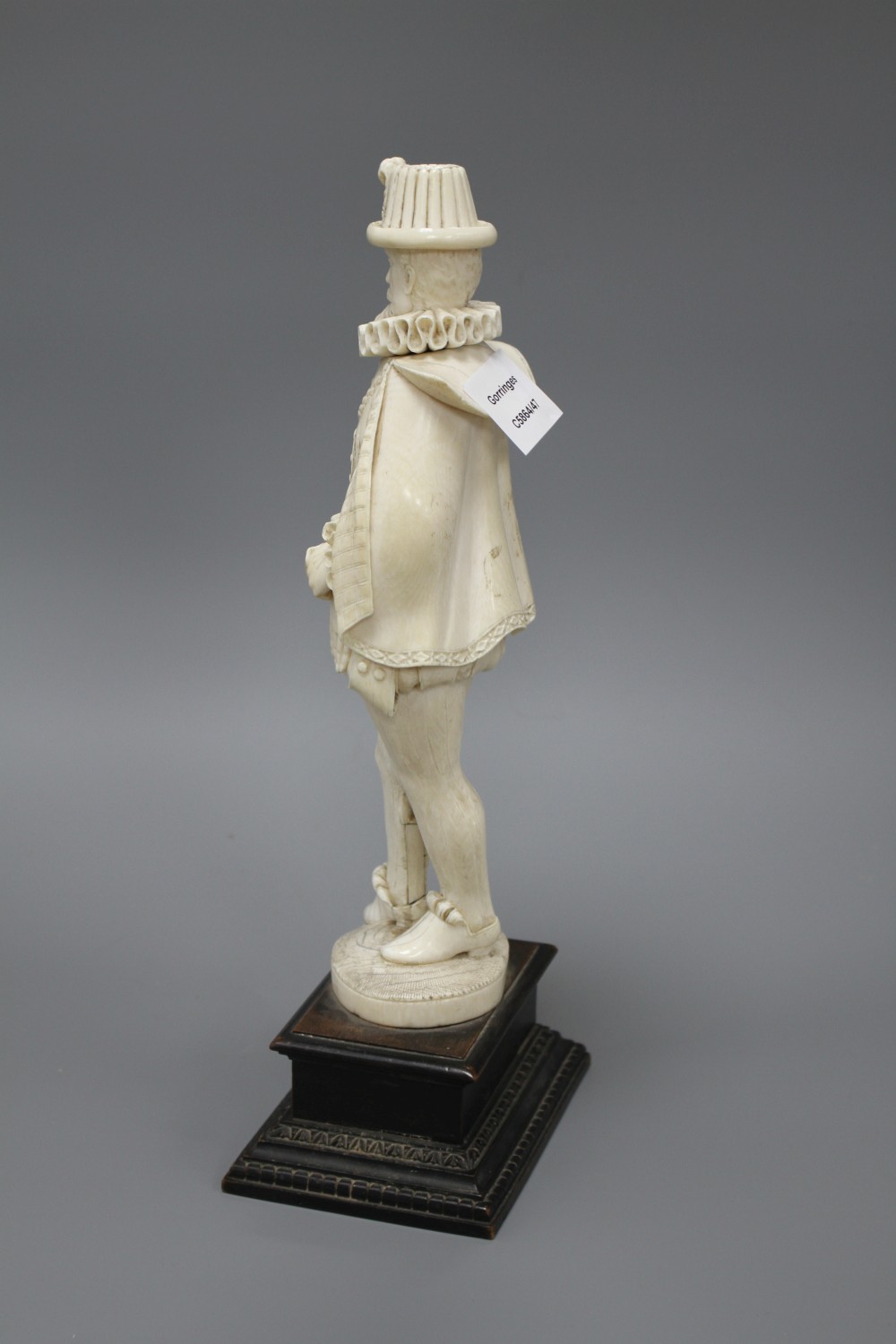 A 19th century Dieppe carved ivory figure of a 17th century gentleman, standing and wearing a ruff colour, height 30cm,